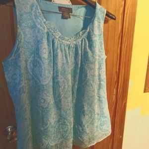 Teal and white sleeveless blouse